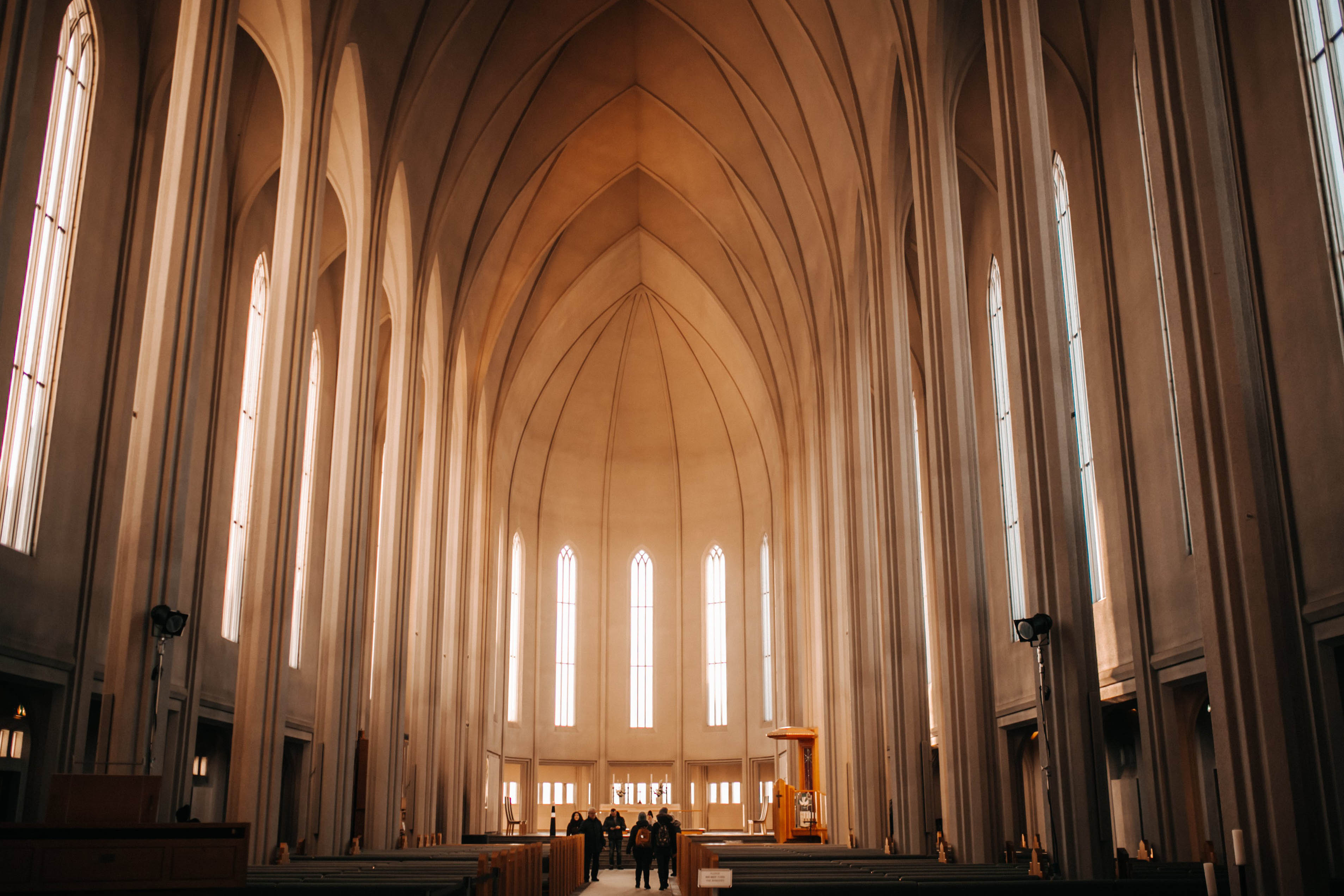 A large cathedral with large windows casting light. The ceiling is architected in such a way to support MHC's tagline of "Elevate your mission"